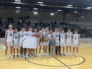 Billings Central Boys Basketball Team poses for a picture with the State Champion Trophy