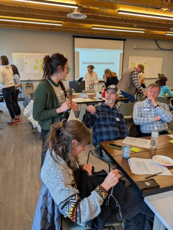 A lady speaking to Glendive Community Members.